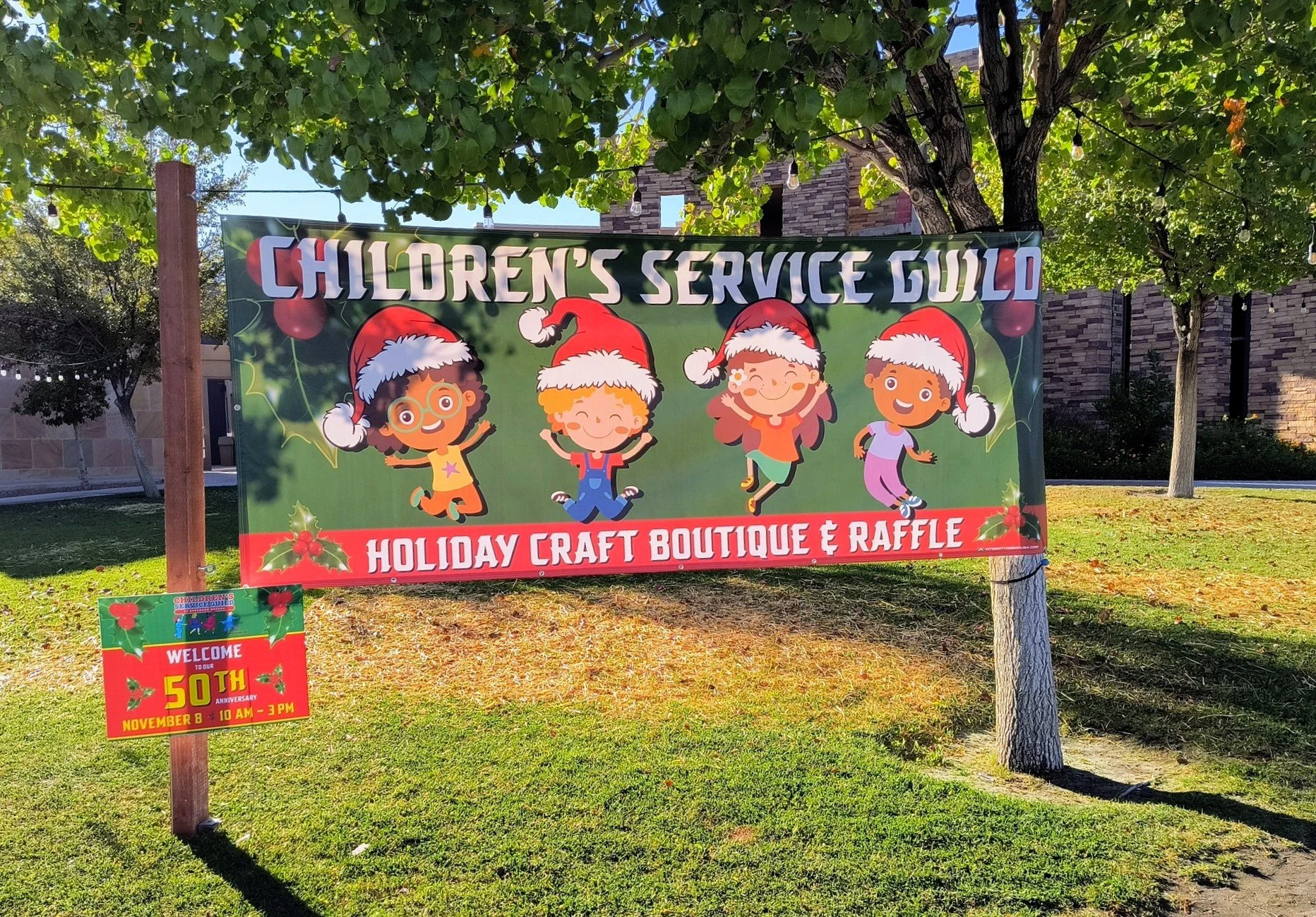 Holiday craft boutique sign with festive children.